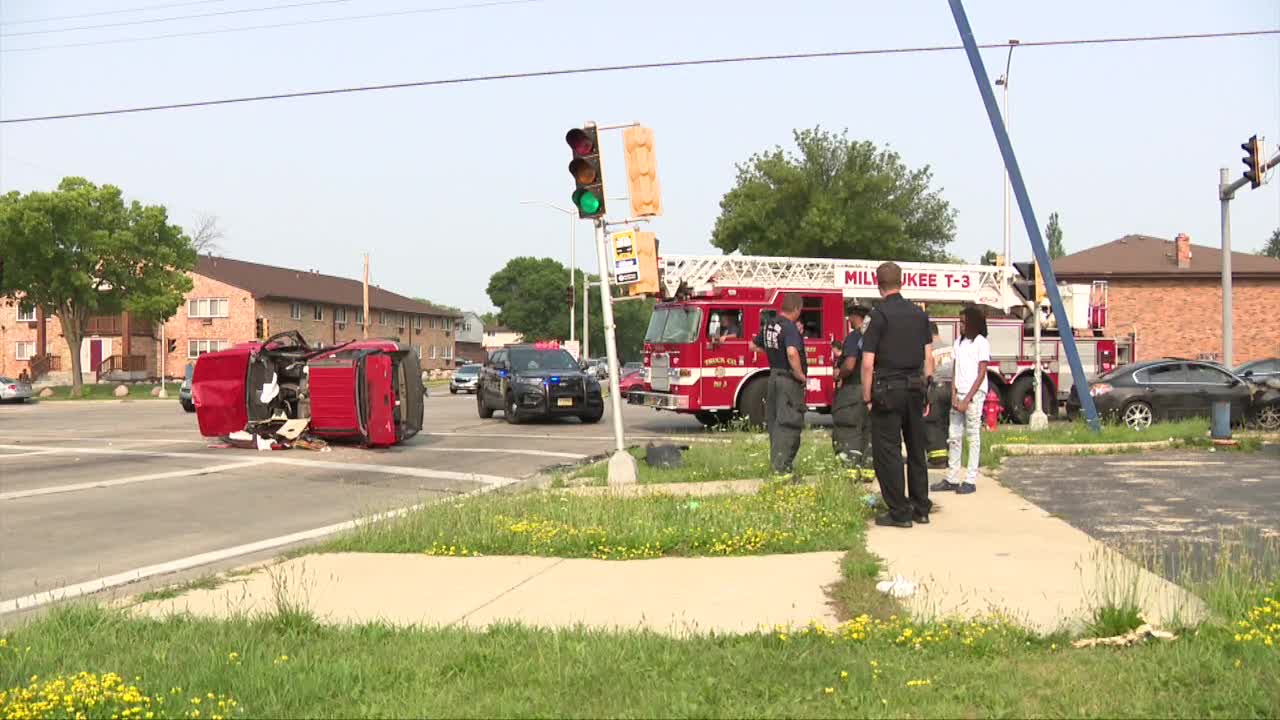 91st and Mill rollover crash; adult, child hurt