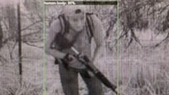 Images show men armed with rifles, body armor coming across southern border