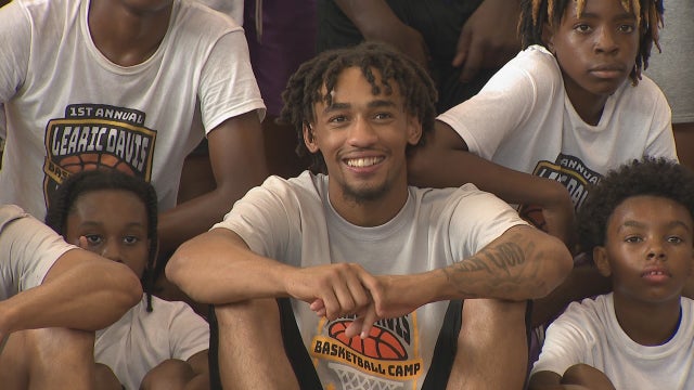 UWM's Davis returns home, brings kids together at basketball camp