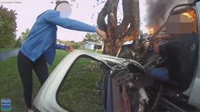 Man trapped in burning car; officer, good Samaritans take action