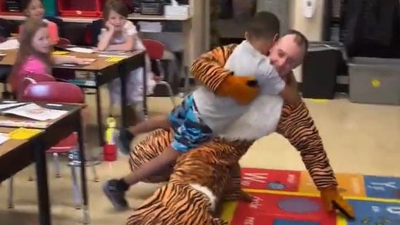 Watch: Father soldier dressed as mascot surprises son on 1st day of school