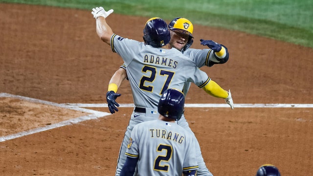 Brewers rout Marlins, clinch postseason berth