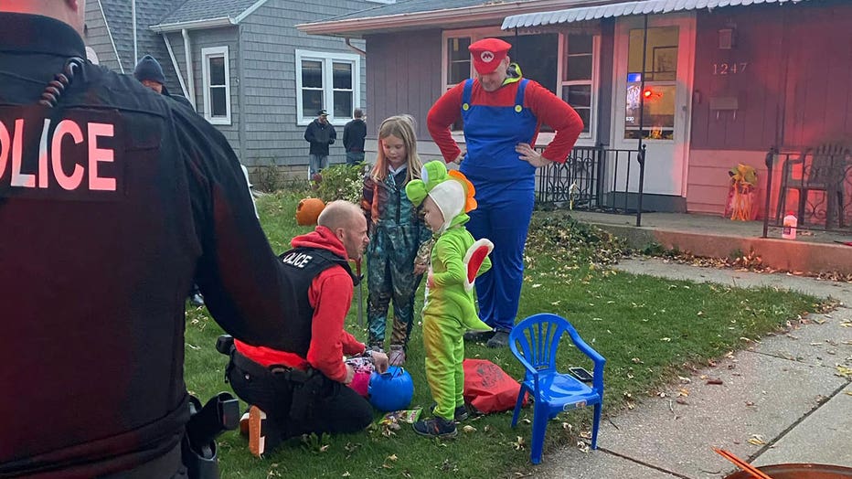 Racine trickortreat parade; officers brighten day of boy with leukemia