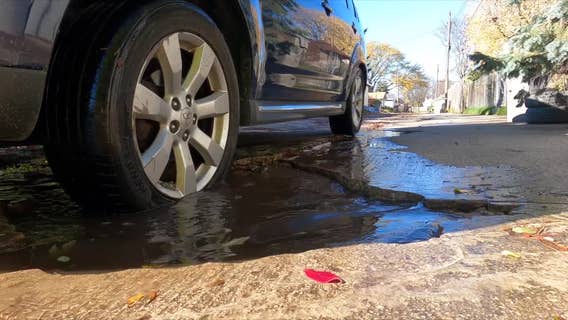 Milwaukee alley potholes; woman wants concrete surface replaced