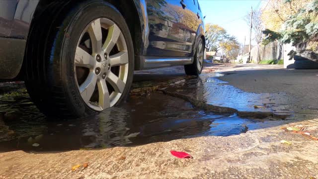 Milwaukee alley potholes; woman wants concrete surface replaced