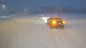 Wisconsin snowstorm; bus driver helps stranded motorist in Milwaukee