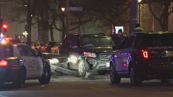 Milwaukee squad struck; woman drove thru barricades, suspected of OWI