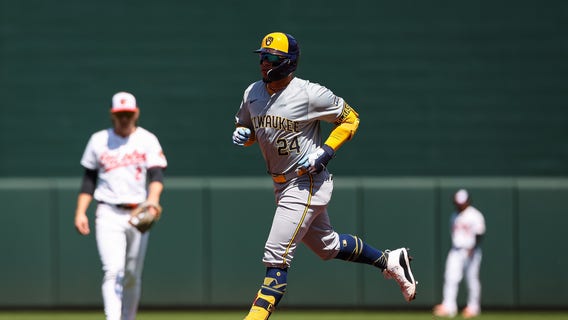 Brewers lose to Orioles, Holliday's first hit helps avoid sweep