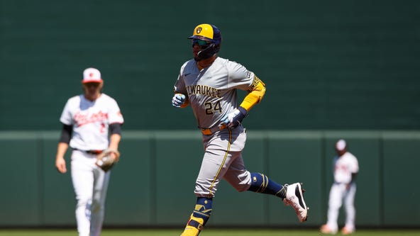 Brewers lose to Orioles, Holliday's first hit helps avoid sweep