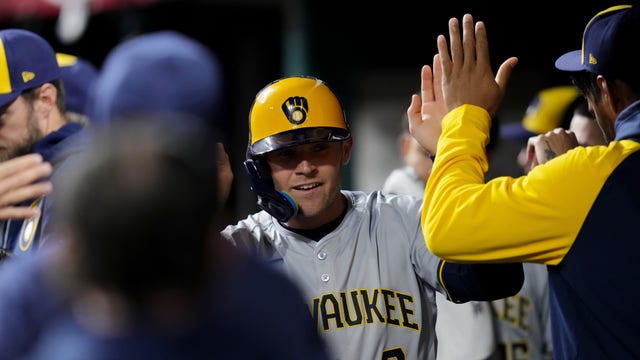 Brewers beat Reds following game delay due to weather