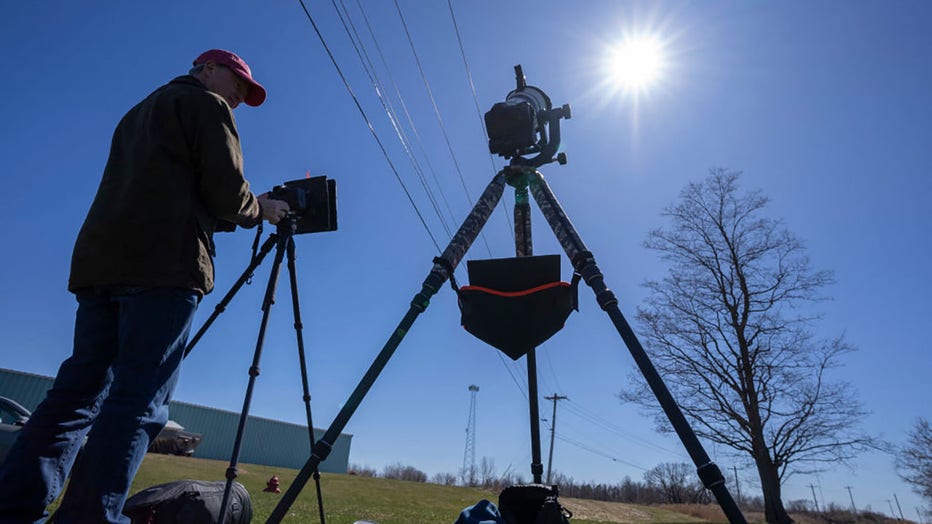 John Bills tests his camera equipment on the eve of a total solar eclipse across North America, in Cape Vincent, New York, on April 7, 2024. (Photo by STAN HONDA/AFP via Getty Images)