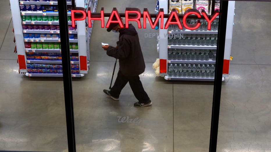 FILE - A man walks through the Walgreens Pharmacy at the Moynihan Train Hall on May 11, 2023, in New York City. (Photo by Gary Hershorn/Getty Images)