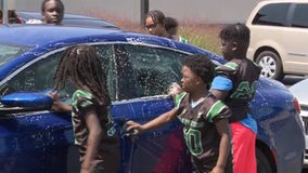 Milwaukee youth football team car wash fundraiser gets kids involved