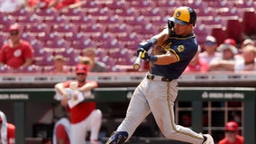 Brewers beat Reds 5-4 in extras in first game of doubleheader