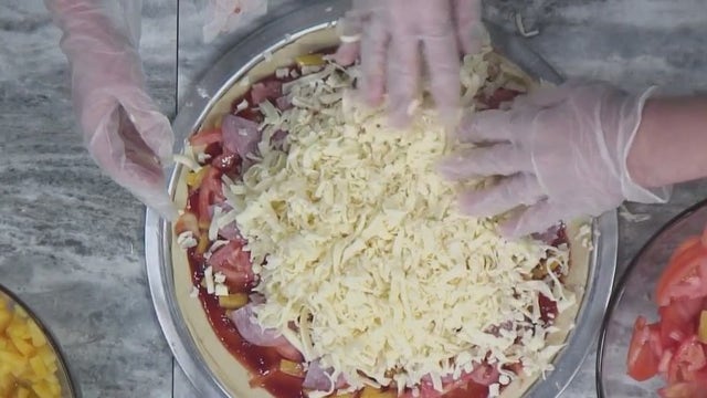 National Hawaiian Pizza Day; does the fruit belong on pizza?