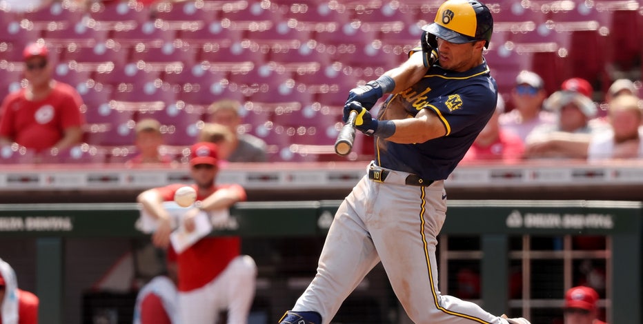 Brewers beat Reds 5-4 in extras in first game of doubleheader