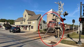 Elm Grove railroad crossing gate struck by truck driver