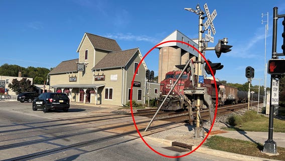 Elm Grove railroad crossing gate struck by truck driver