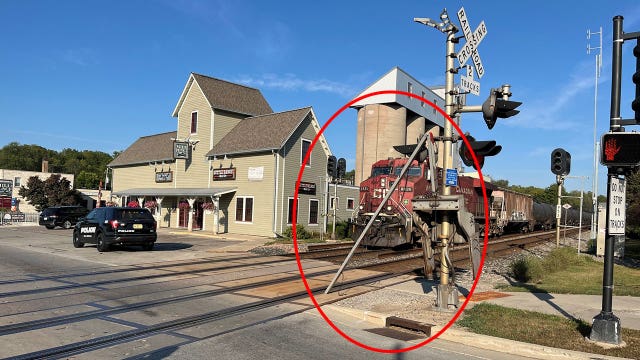 Elm Grove railroad crossing gate struck by truck driver