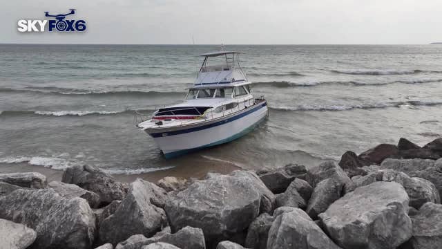 Lake Michigan mystery boat; Milwaukee beach sees boat wash ashore