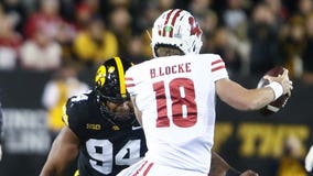 Iowa routs Wisconsin; Locke, Williams connect for Badgers' only TD