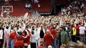 Wisconsin Badgers upset Arizona, fans storm Kohl Center court