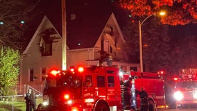 Milwaukee house fire, 6th and Burleigh; 1 helped off porch