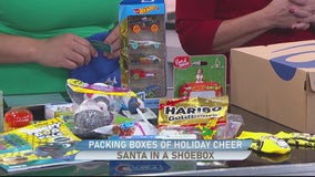 Santa in a Shoebox; Packing boxes of holiday cheer