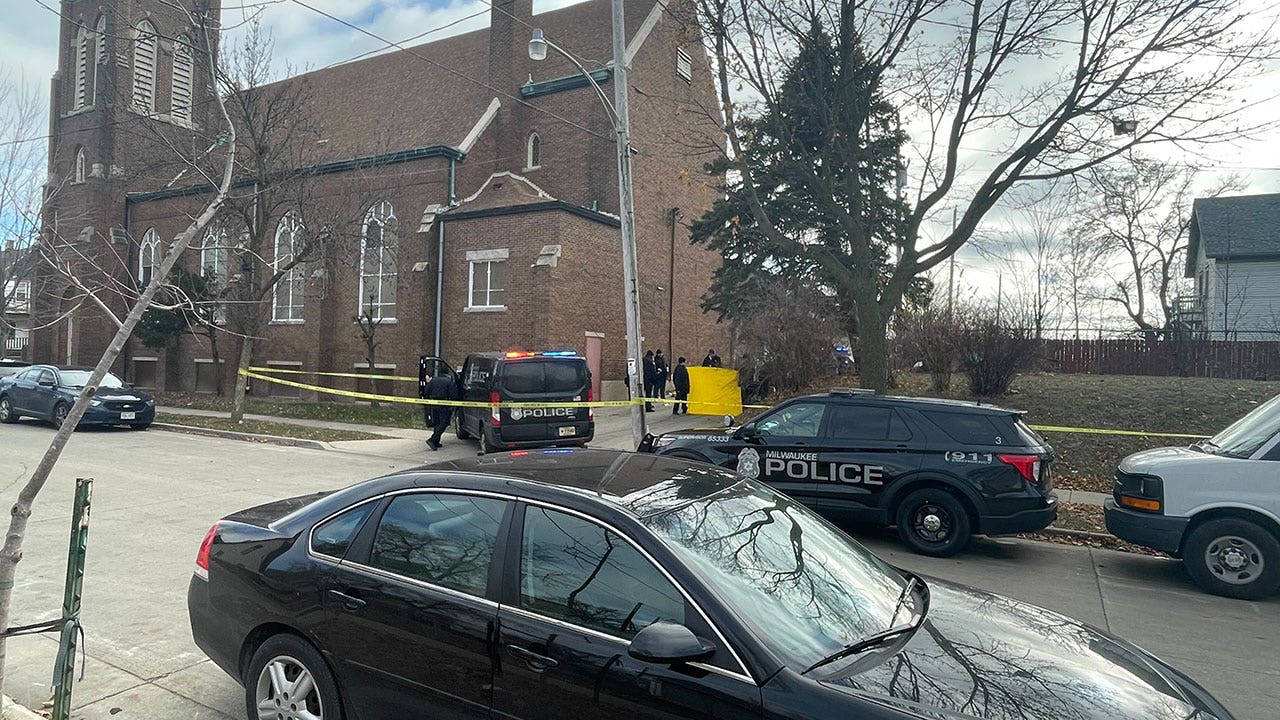 Milwaukee police presence, 38th and Lloyd; alley behind church