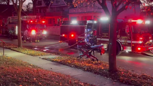 Milwaukee house fire, 28th and Locust; Red Cross assisting displaced family