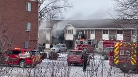 Pewaukee apartment building fire; officer burned, resident hurt