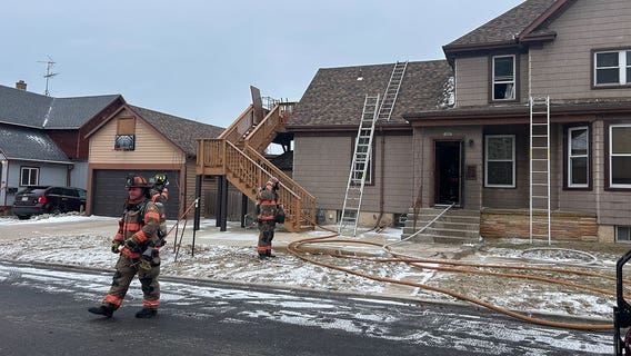 Sheboygan house fire; smoke seen from 2nd story of residence