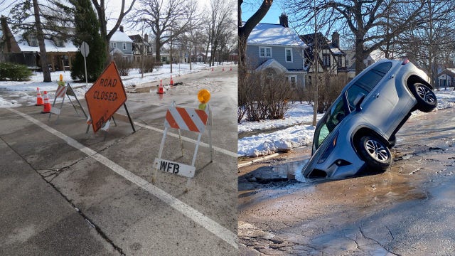 Whitefish Bay sinkhole; driver ignores road closure sign, roadway collapses