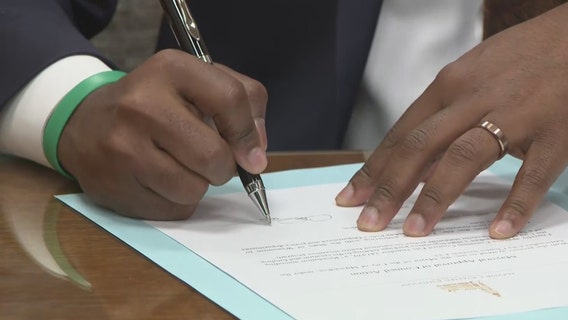Police recruitment bonuses; Milwaukee mayor ceremonially signs file