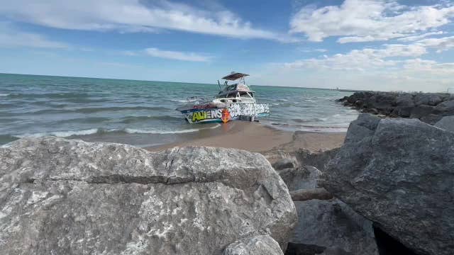 Abandoned boat still on Lake Michigan shore; man asks mayor for help