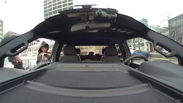 Car break-in captured by dash camera at Milwaukee parking lot