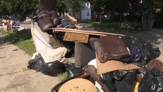 Milwaukee flood reporting; victims experience long waits for 211