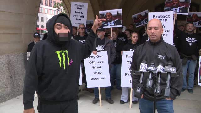 Milwaukee police pay: Union protests, activists counter-protest