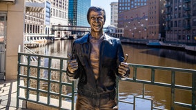 Henry Winkler birthday party, Milwaukee holding Bronze Fonz bash