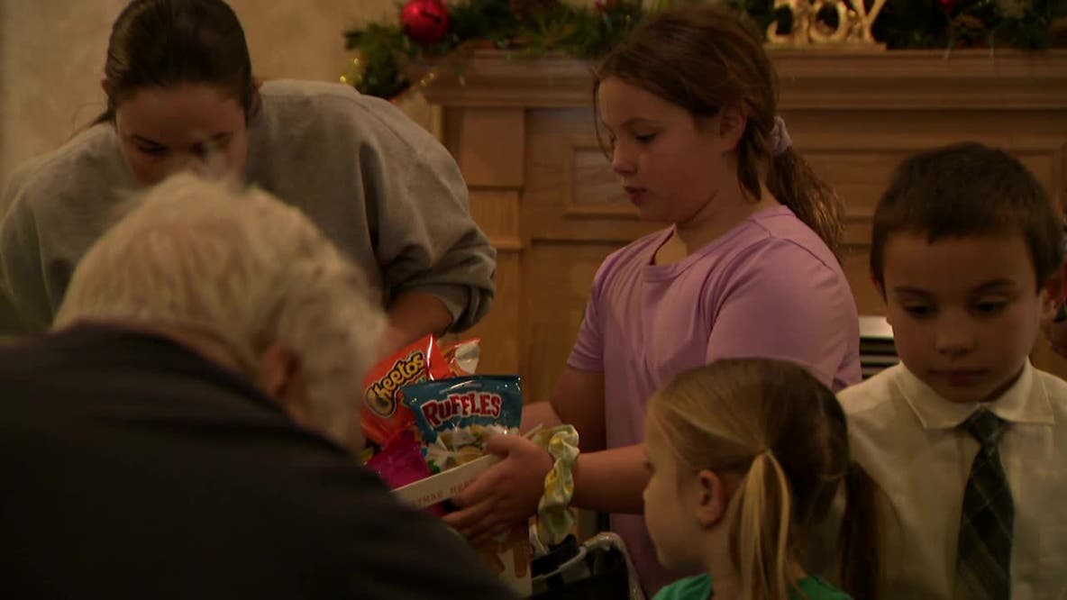 South Milwaukee students spread holiday cheer at assisted living facility