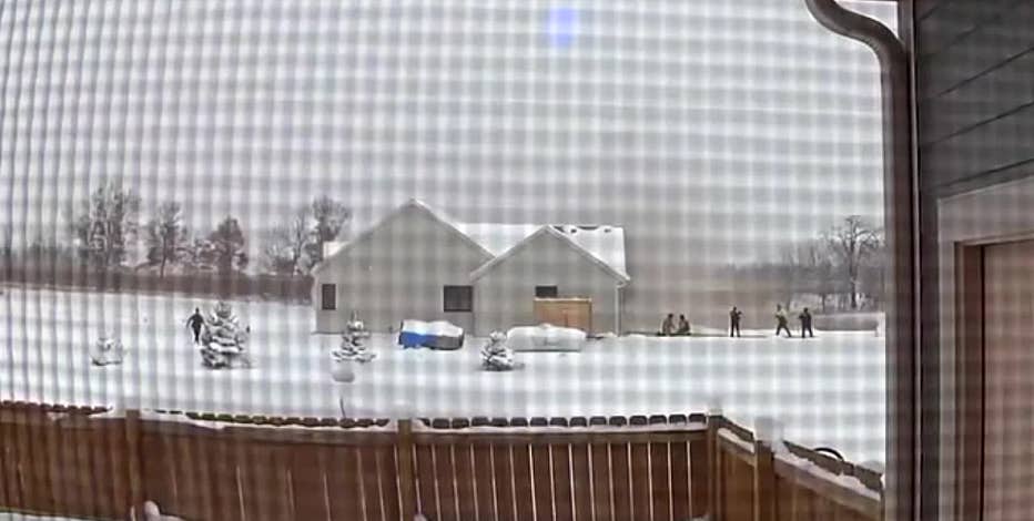 Fatal Raymond house fire new video; child rescued, woman dead