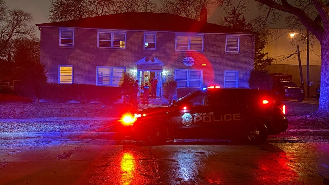 Milwaukee apartment fire; unconscious person taken to hospital