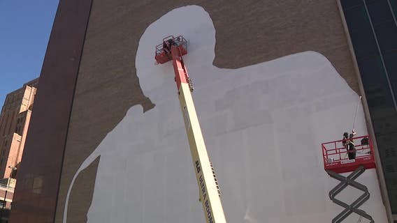 Downtown Milwaukee Bob Uecker mural being installed