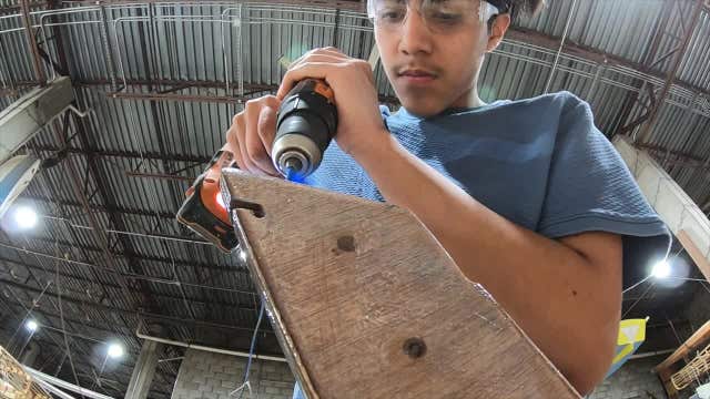 El Puente High School sophomore building life skills, sailboat