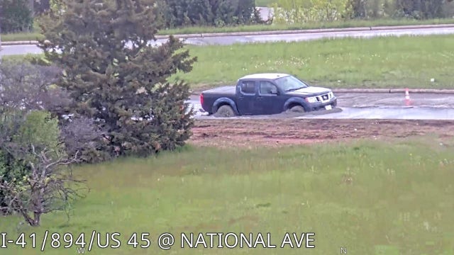 Wisconsin driver removes ‘road closed’ barrier; stuck in fresh concrete