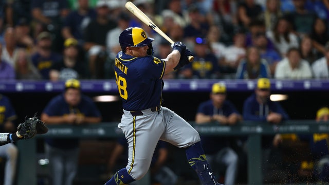 Brewers score 8 late runs, stun Rockies 9-7 in wild 10-inning victory