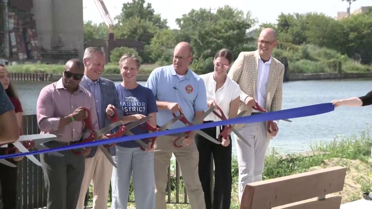 Milwaukee Harbor District Riverwalk ribbon cutting; transforms inner harbor