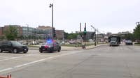 Milwaukee police shooting; officer struck by fleeing driver, later arrested