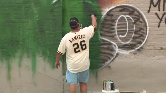 Milwaukee Giannis mural vandalized; artist touches up damaged art