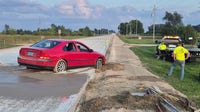 Wisconsin driver ignores 'road closed' sign, pulls into fresh concrete